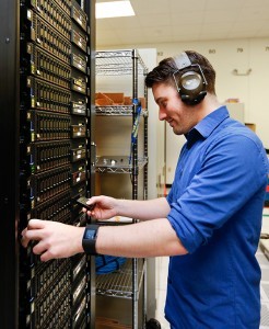 Philip Curtis, a member of the High-Performance Computing Operations group at the OLCF, works with Pike, one of the test systems being used to prepare for Summit.