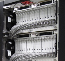 DEEP Cluster nodes with front-panel connectors for the Ethernet-based service network. Power, Infiniband® and liquid cooling connectors are embedded into the backplane for minimal maintenance overhead.